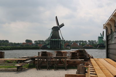 Traditional windmill with river in background