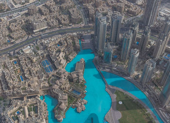 Aerial view of river amidst buildings