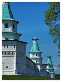 Low angle view of building against clear blue sky