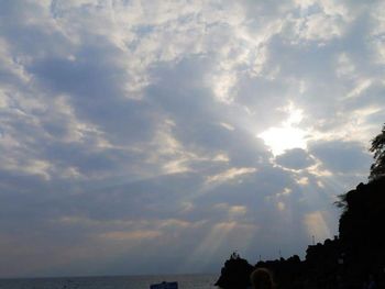 Scenic view of sea against cloudy sky