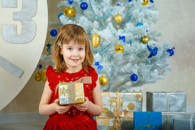 Portrait of a girl in christmas tree