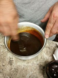 Close-up of cropped coffee cup