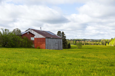 House on field against sky