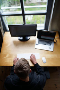 High angle view of man using mobile phone