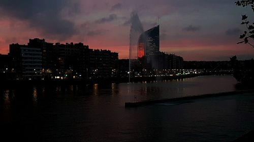 View of city at night during sunset