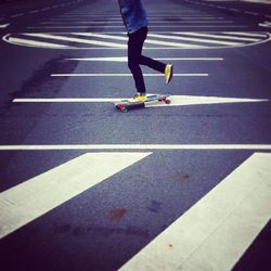 Low section of people walking on road