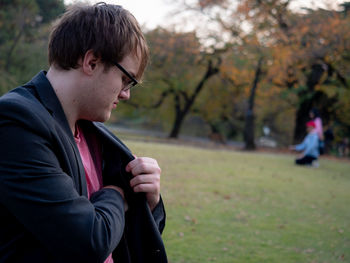 Side view of young man looking away