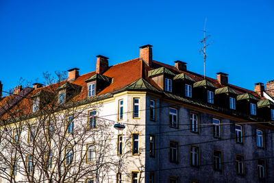 Low angle view of building against clear blue sky