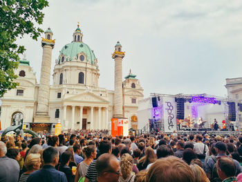 Group of people in front of buildings in city