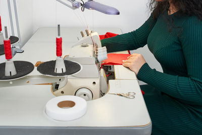 Midsection of woman working at home