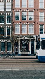 Street by buildings in city