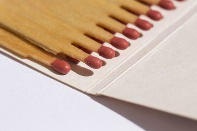 Close-up of hand on wooden table