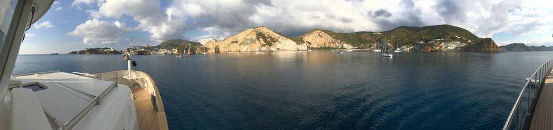 Panoramic view of bay against sky