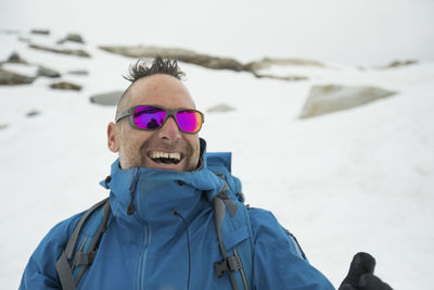 Mountain climber, adam palmer, laughing outdoors.