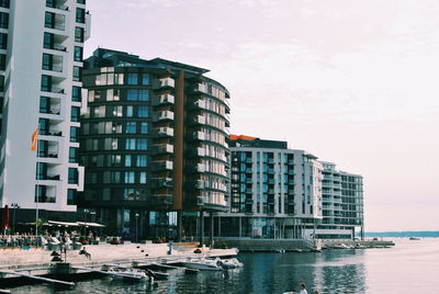 Buildings in city against sky