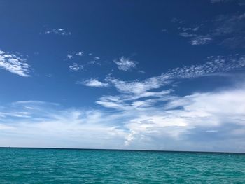 Scenic view of sea against blue sky