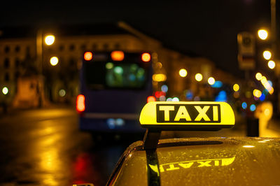 Yellow taxi sign in the night