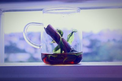 Close-up of drink in glass jar on table