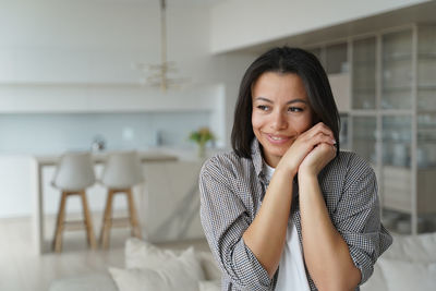 Portrait of young woman looking away