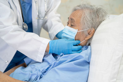 Doctor examining patient in clinic