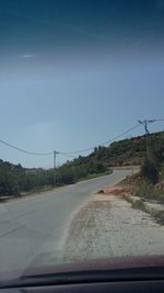 Road seen through car windshield