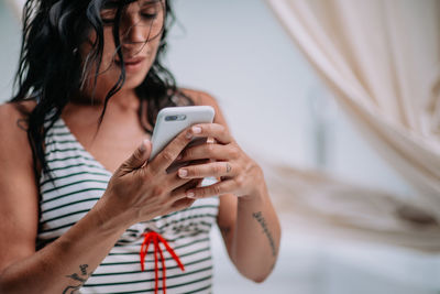 Young woman using mobile phone