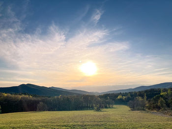 Scenic view of landscape against sky during sunset