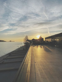 Scenic view of river against sky during sunset