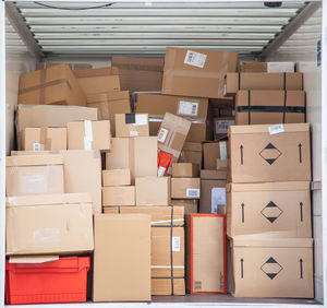 Stack of cardboard boxes in cargo container