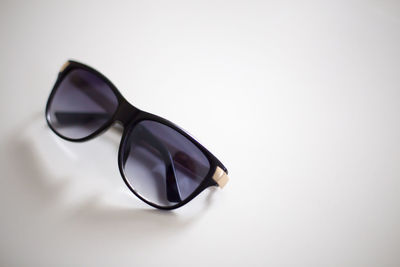 Close-up of sunglasses against white background