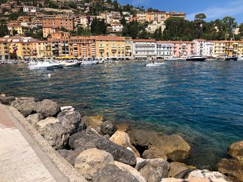 Scenic view of sea by town