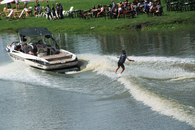 People on boat in river