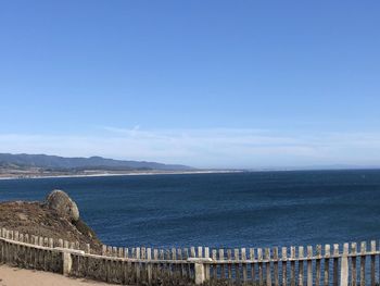 Scenic view of sea against blue sky