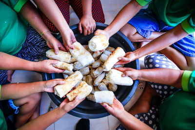 High angle view of people holding hands