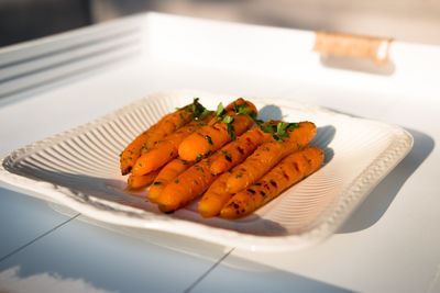 Carrots in plate on table