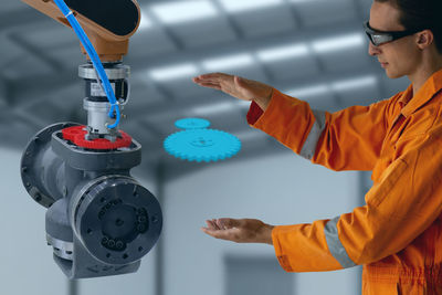 Low angle view of man working on table