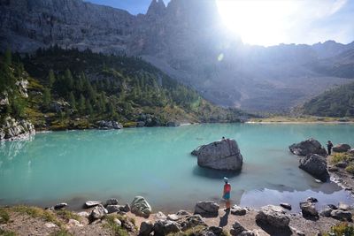 Scenic view of lake and mountains against sky