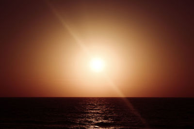 Scenic view of sea against clear sky during sunset