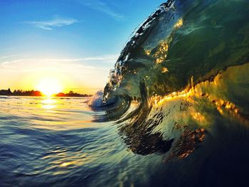 Scenic view of sea at sunset