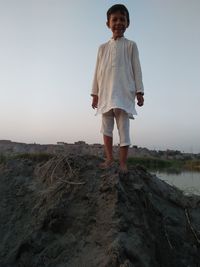 Portrait of man standing on land