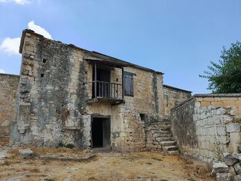 Low angle view of old building against clear sky