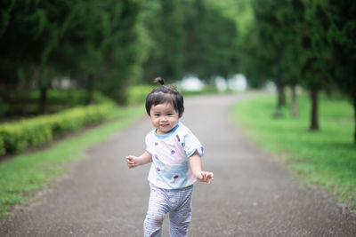 Full length of cute girl standing at park