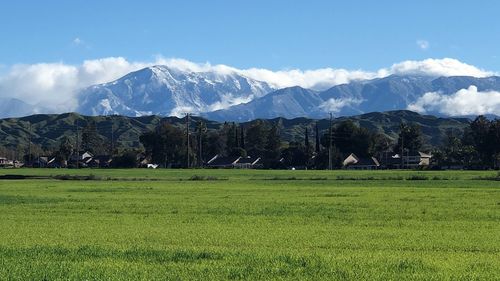 Scenic view of landscape and mountains against sky