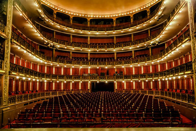 Low angle view of illuminated lighting equipment in balcony