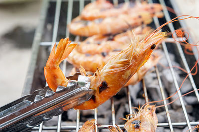 Close-up of meat on barbecue grill