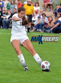 Woman standing on soccer field