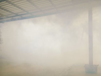 Low angle view of fog against sky