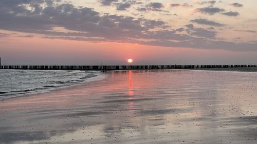 Scenic view of sea against sky during sunset