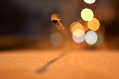 Close-up of illuminated lights at night