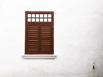 Close-up of window on white wall